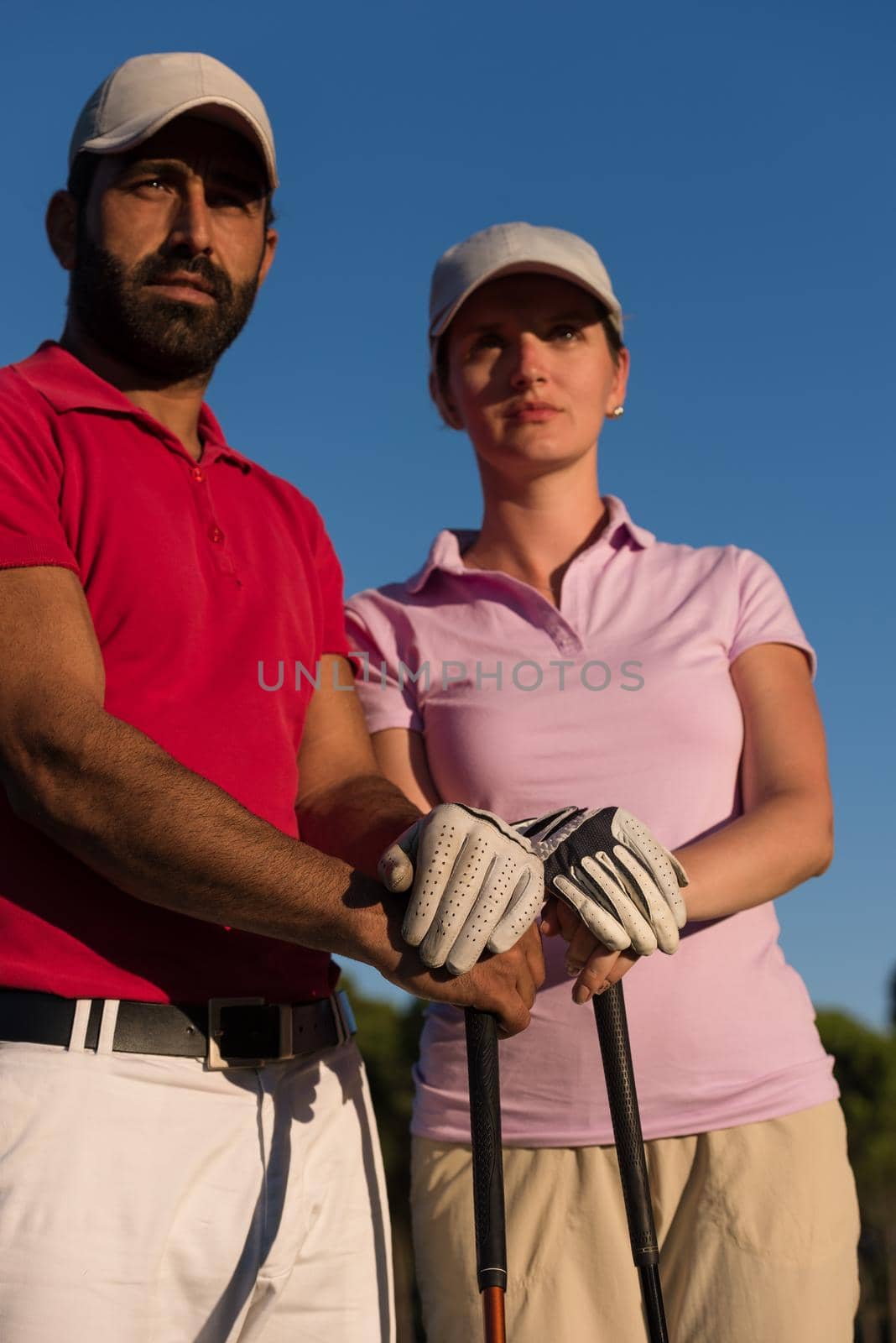 portrait of happy young  couple on golf course