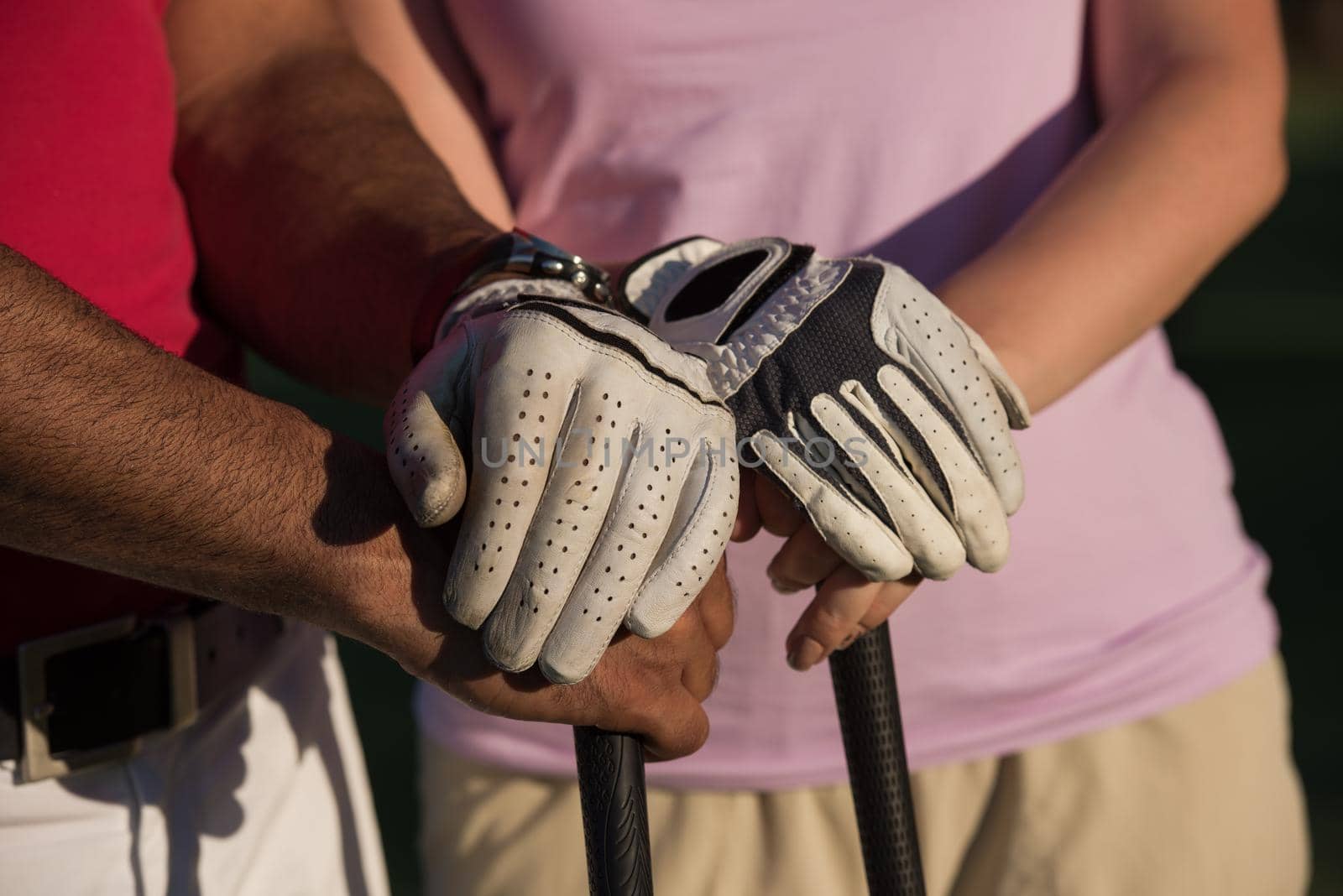 portrait of happy young  couple on golf course