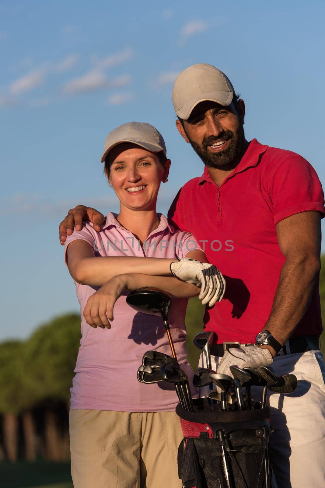 portrait of happy young  couple on golf course