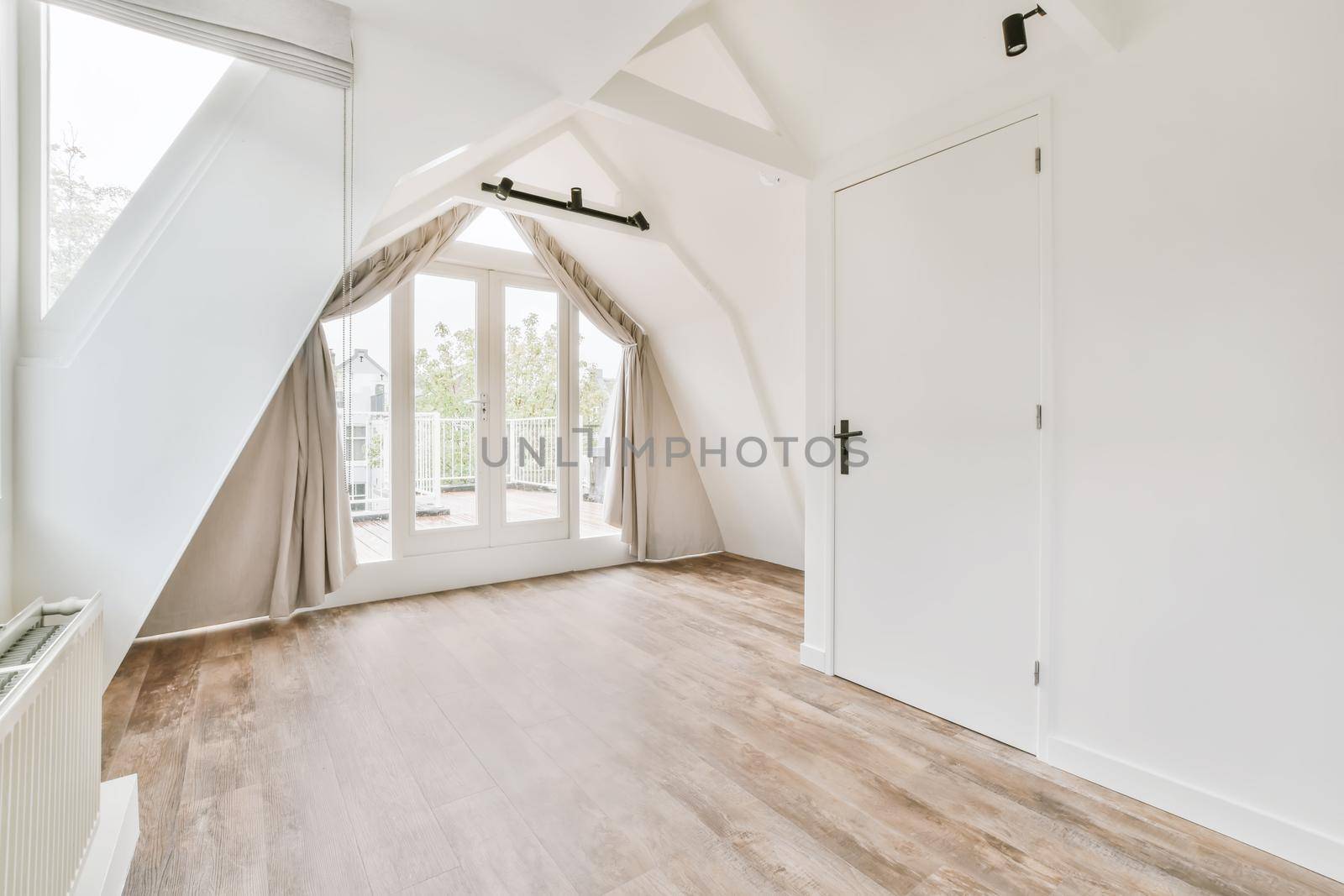 Large doors of unusual shape leading to the balcony