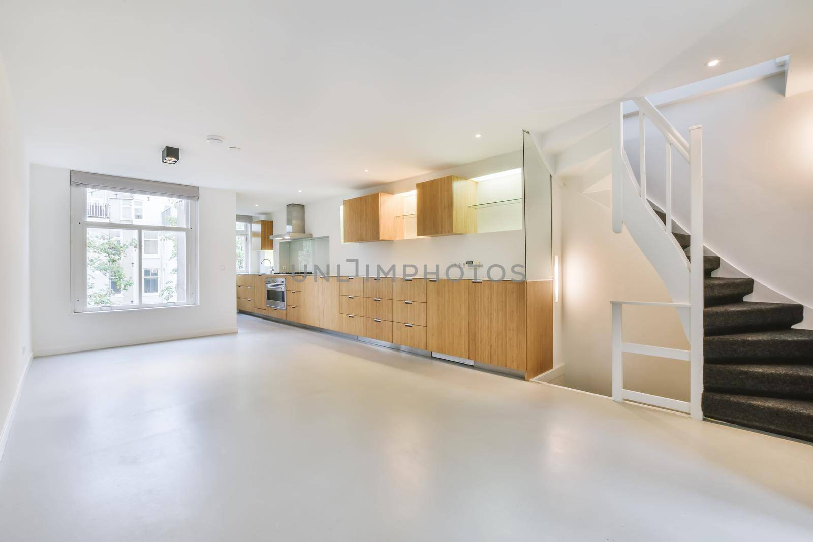 Long kitchen area with wooden kitchen unit