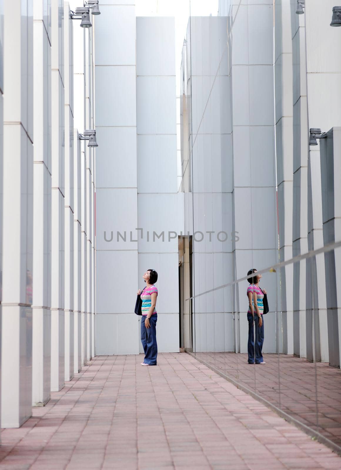 Beautiful woman  outdoor modern city urban street scene with abstract  glass reflections