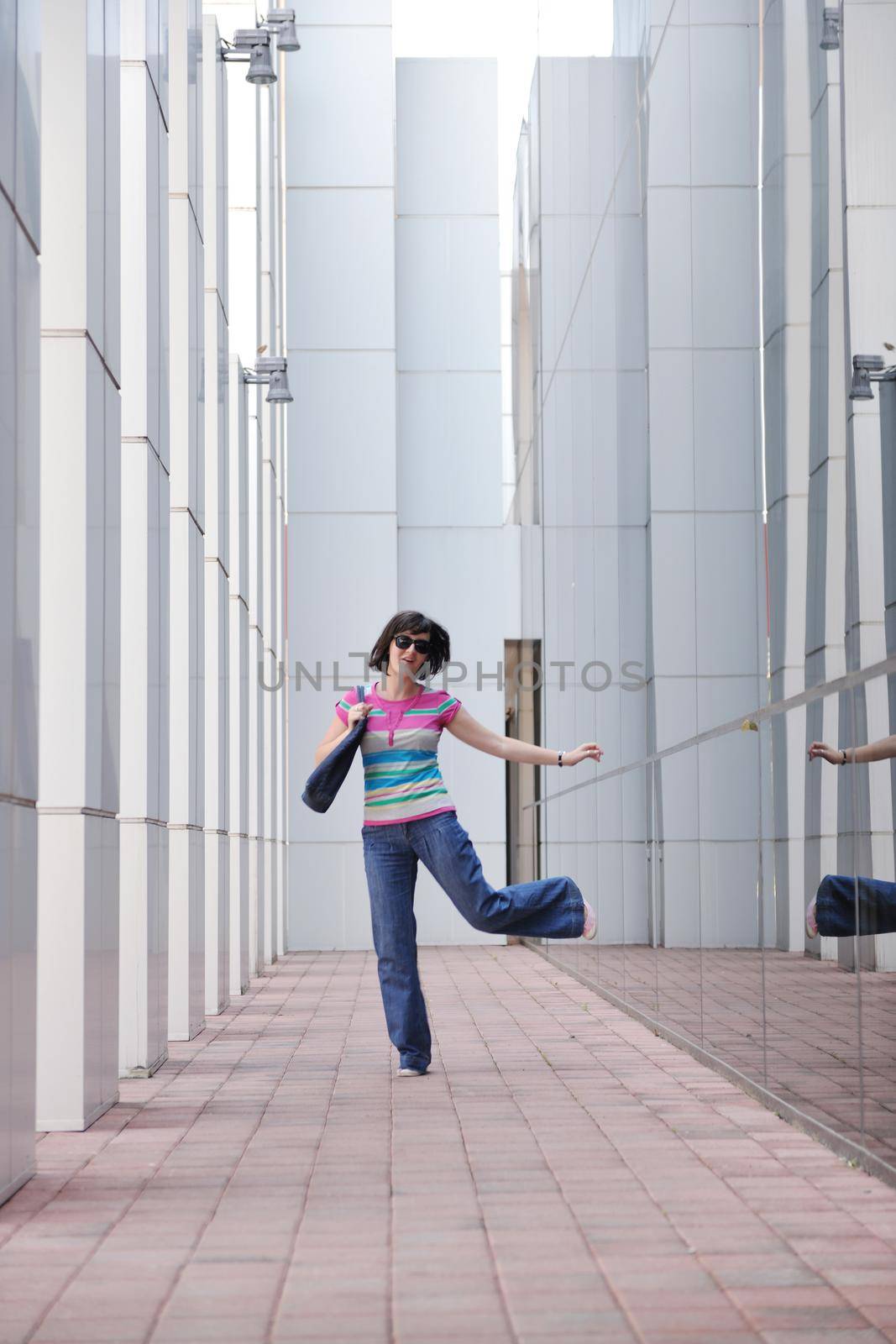 Beautiful woman  outdoor modern city urban street scene with abstract  glass reflections