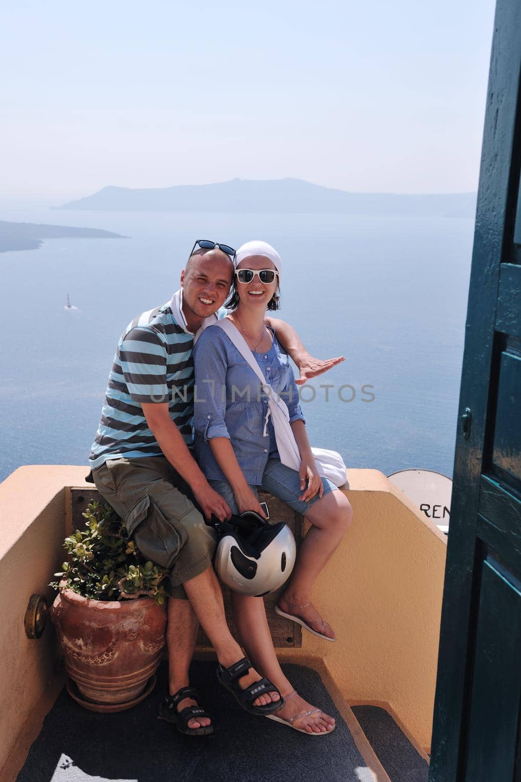 happy young couple tourists in greece by dotshock
