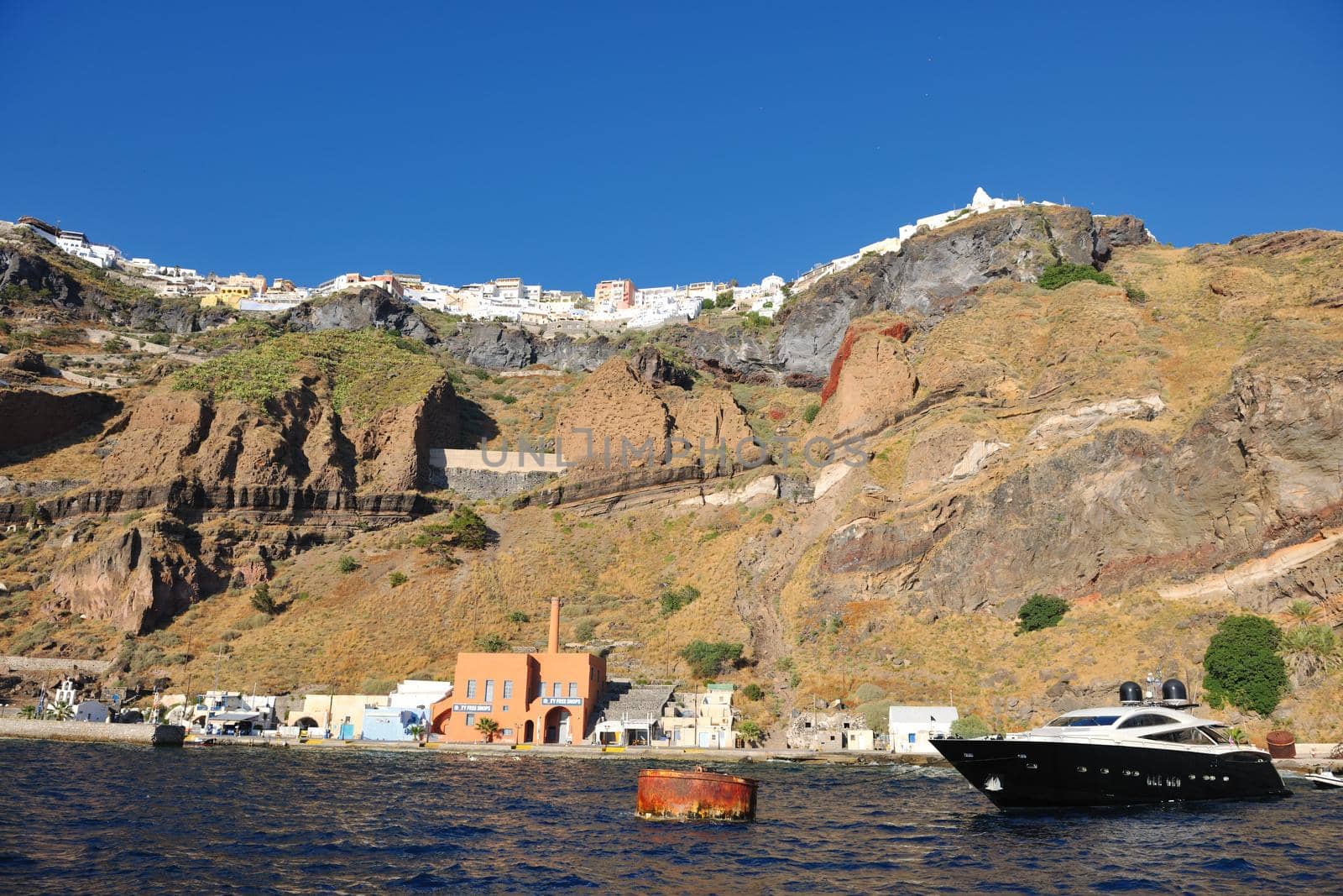 santorini island coast with luxury yacht by dotshock