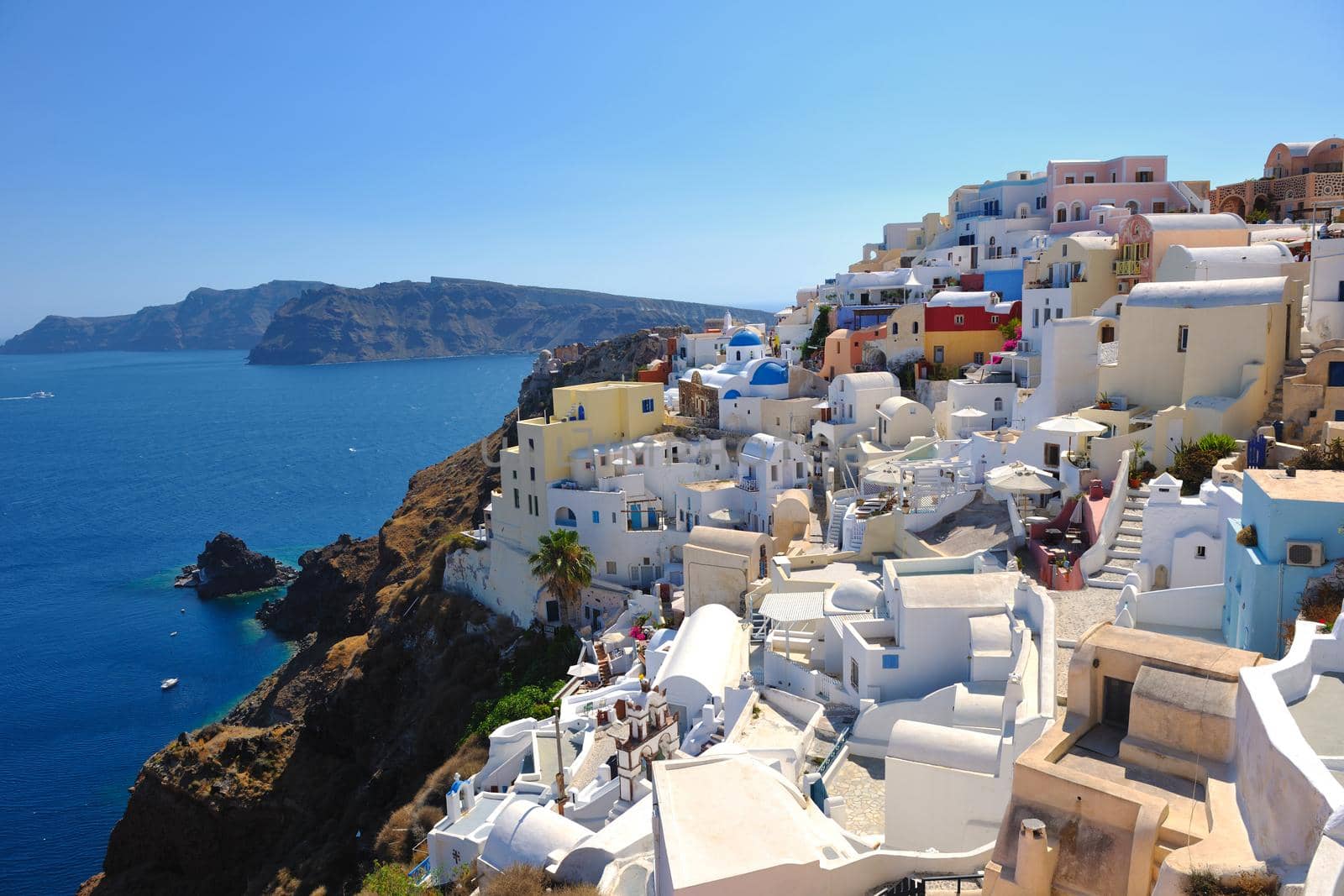 summer vacation on beautiful vulcanic island santorini at greece