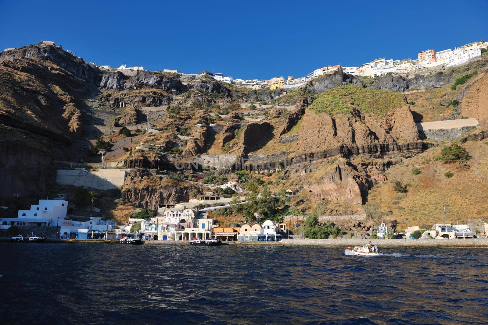 summer vacation on beautiful vulcanic island santorini at greece