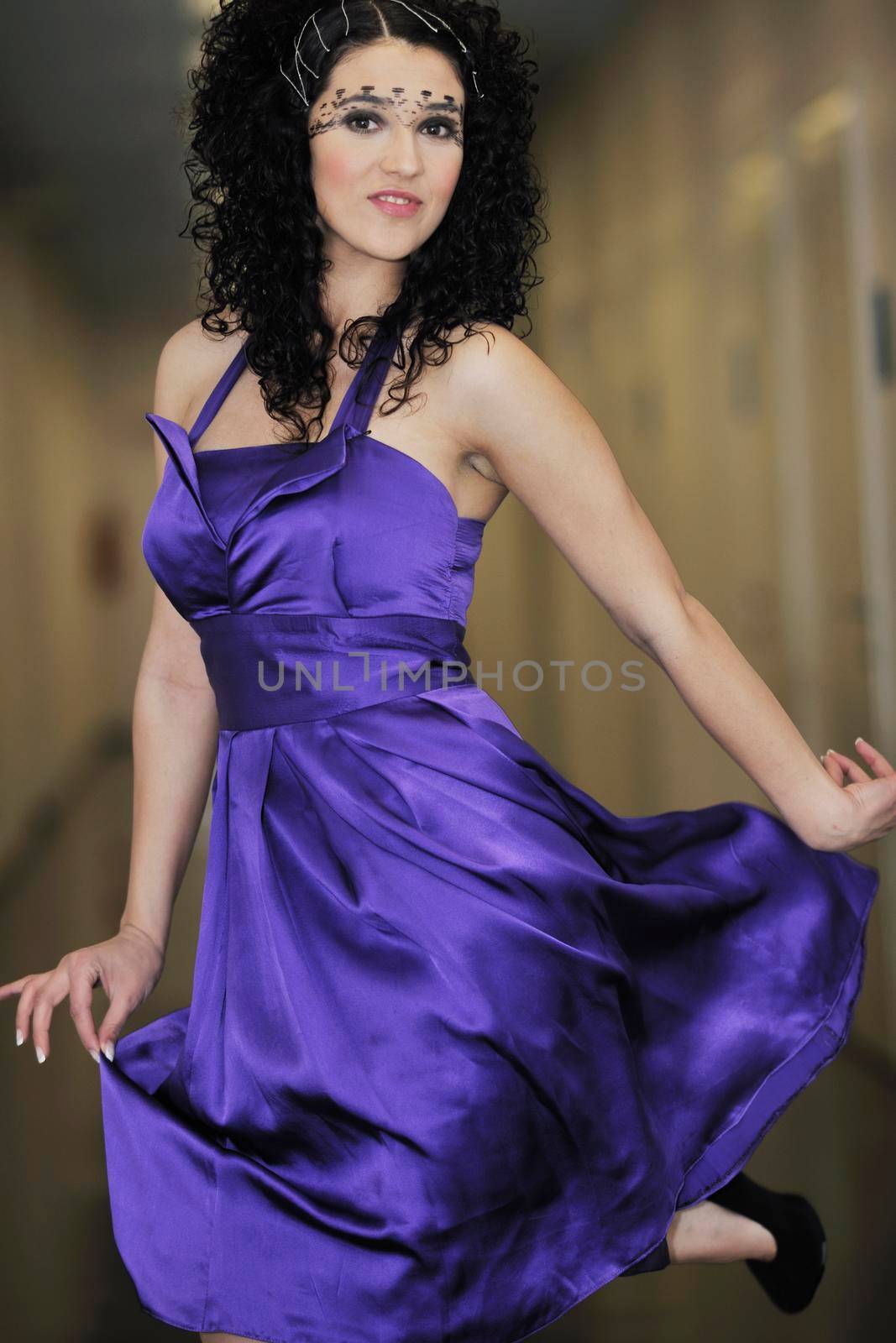 portrait of beautiful young woman with nice hairstyle and fashionable clothing and dress