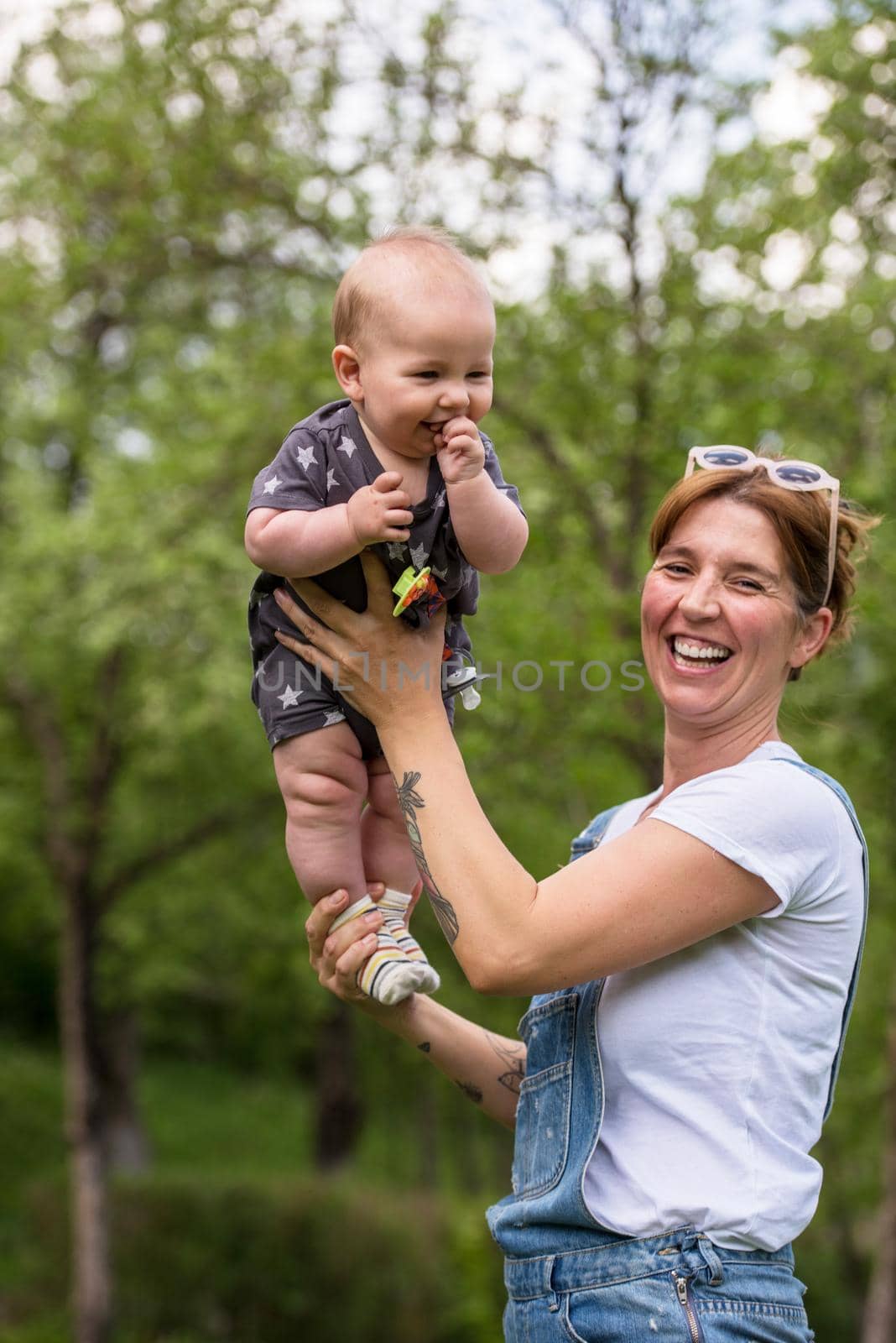 woman with baby have fun in nature