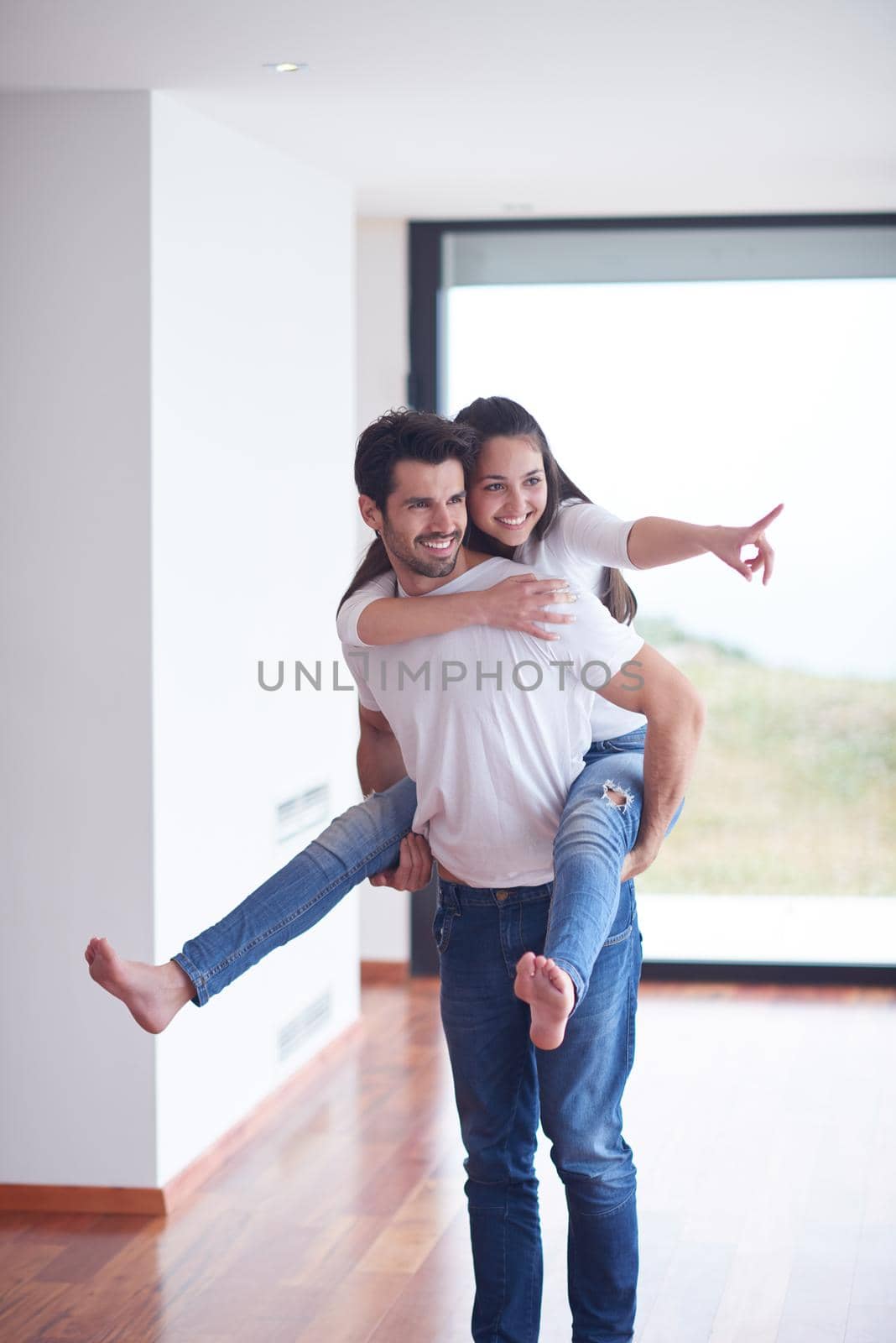 happy young romantic couple have fun and  relax at home by dotshock