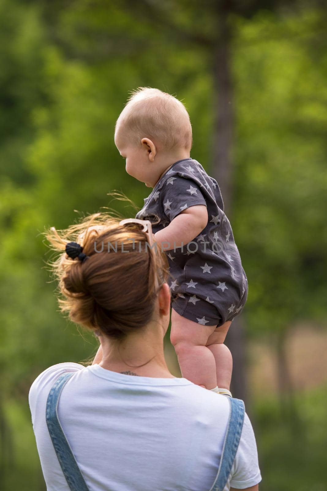 woman with baby have fun in nature