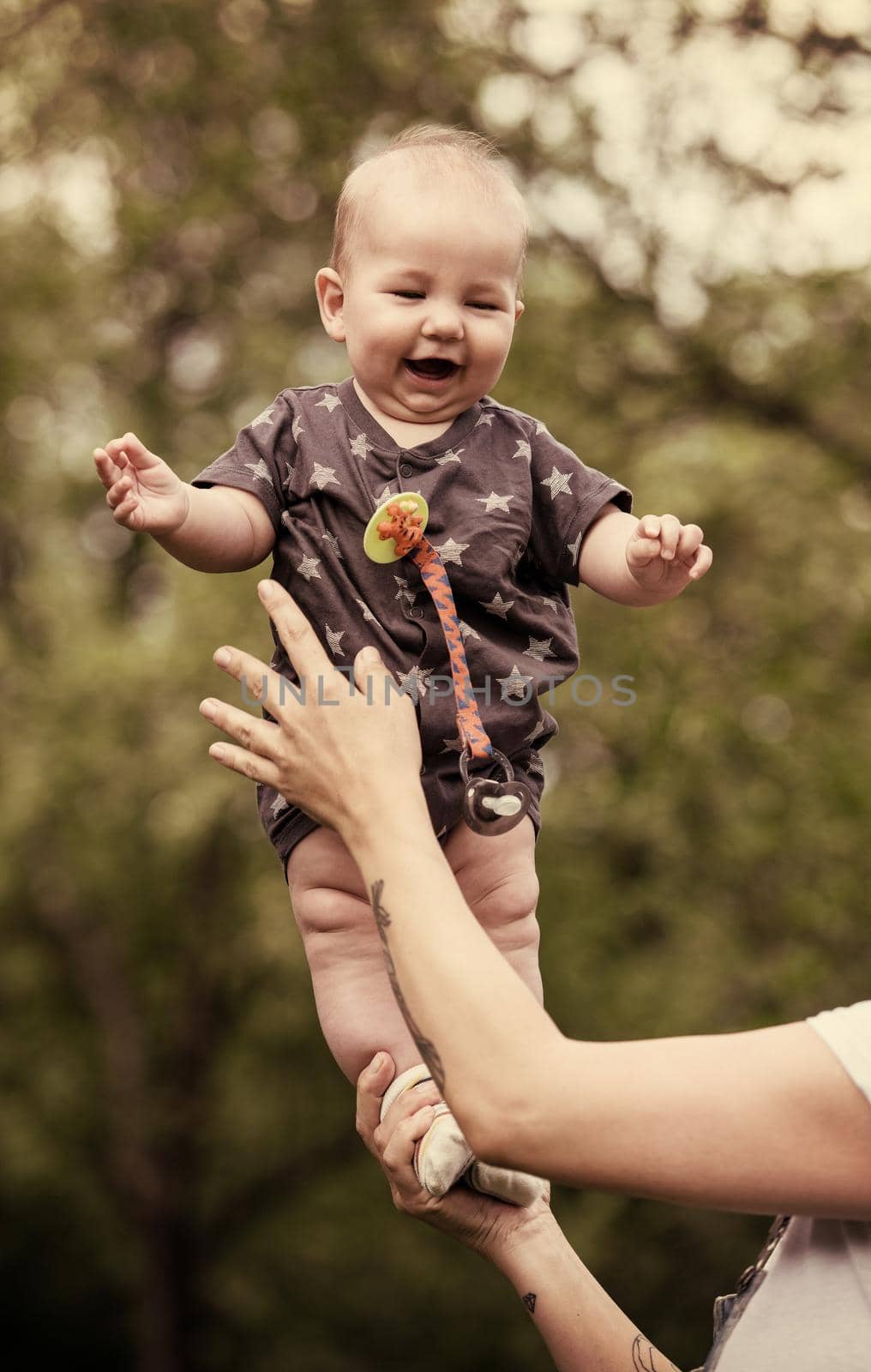 woman with baby have fun in nature