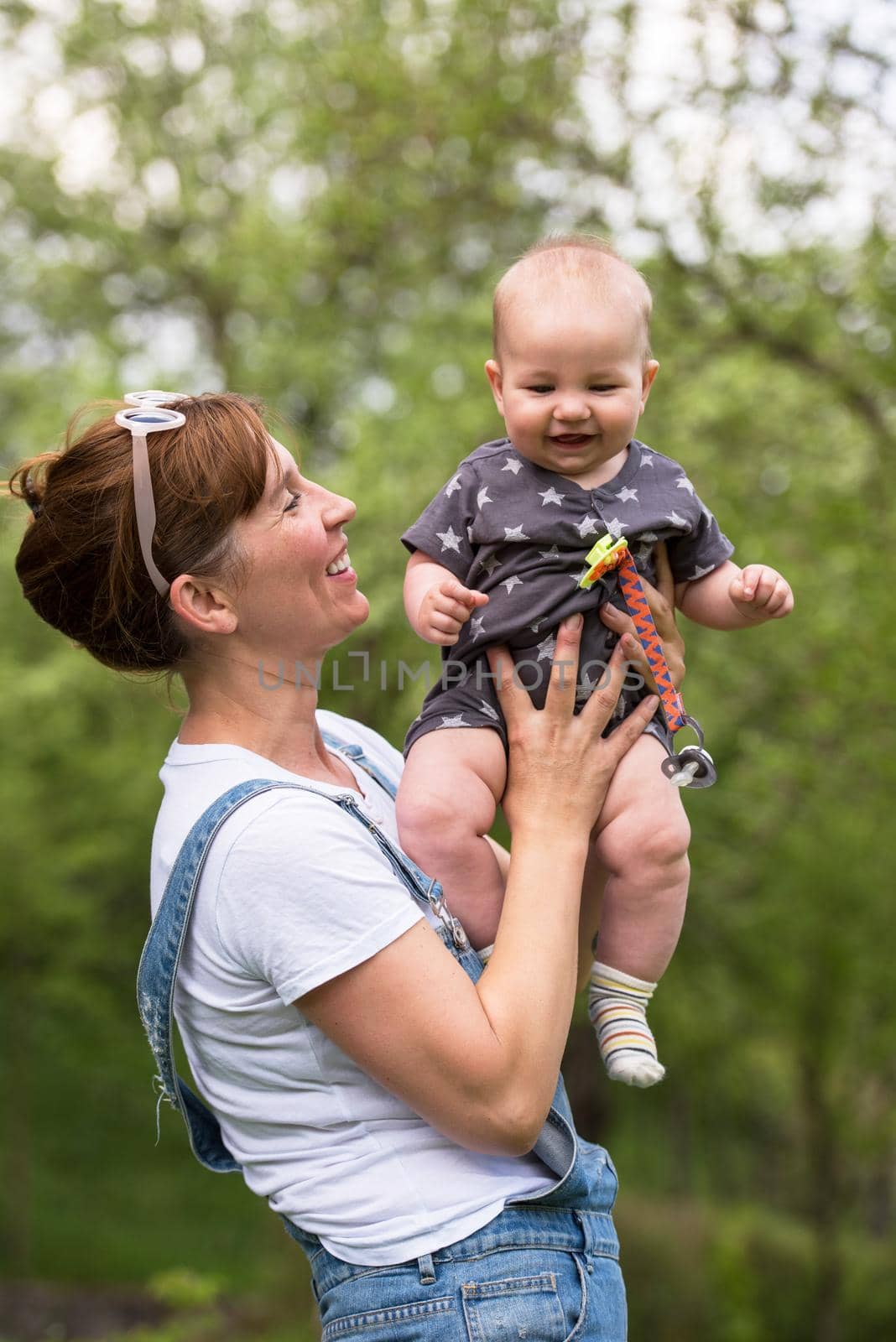 woman with baby have fun in nature