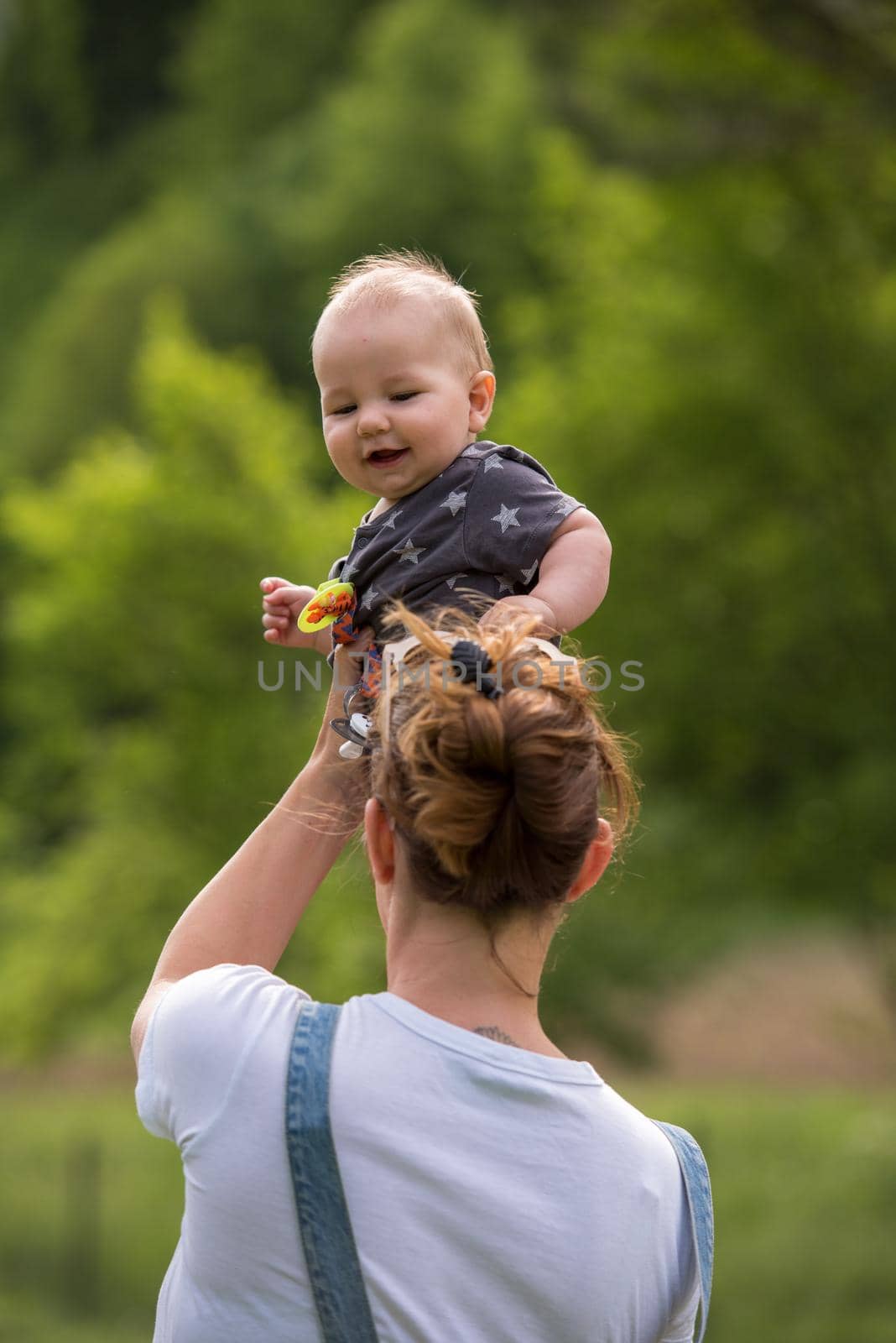 woman with baby have fun in nature