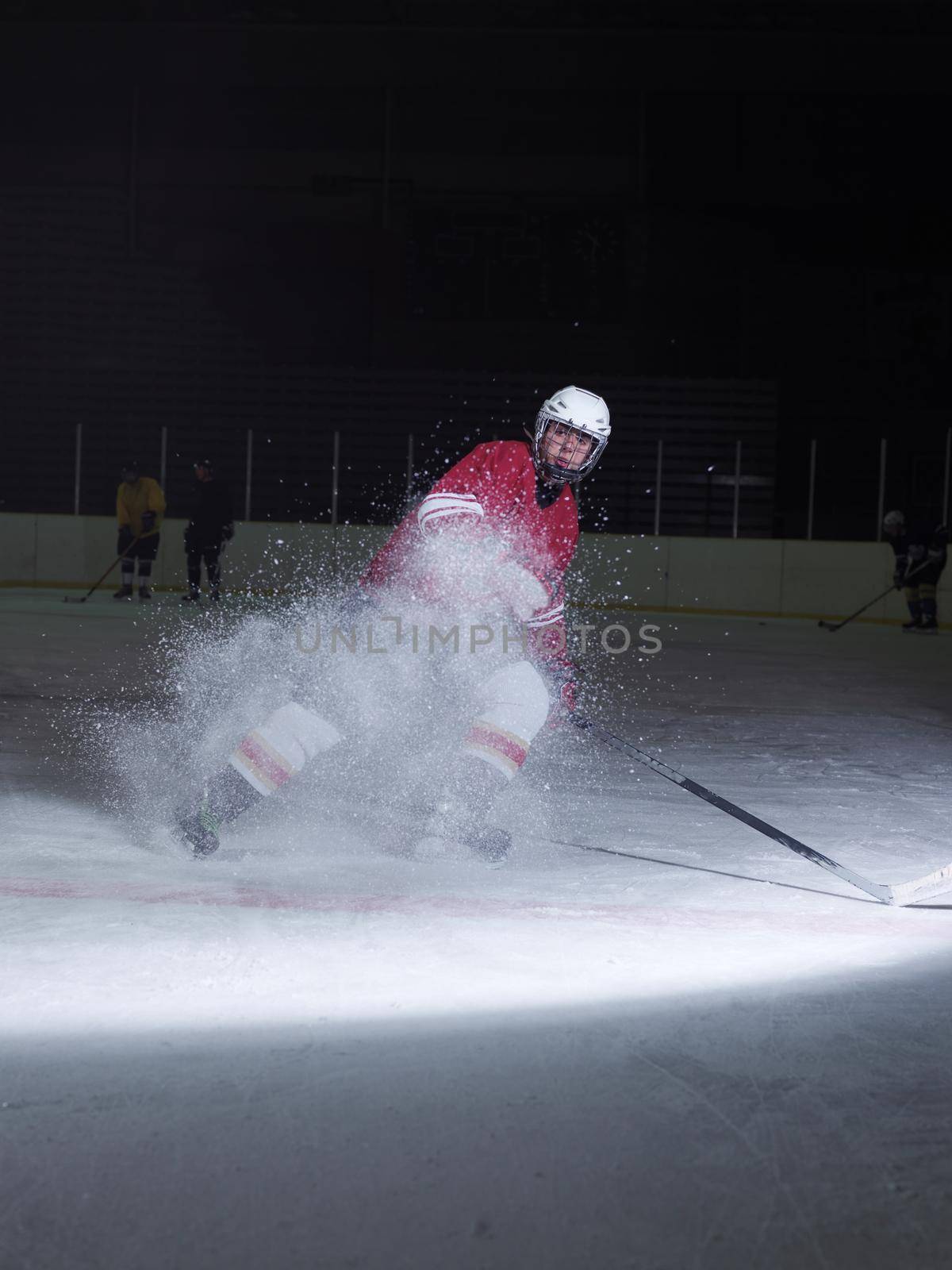 ice hockey player in action kicking with stick