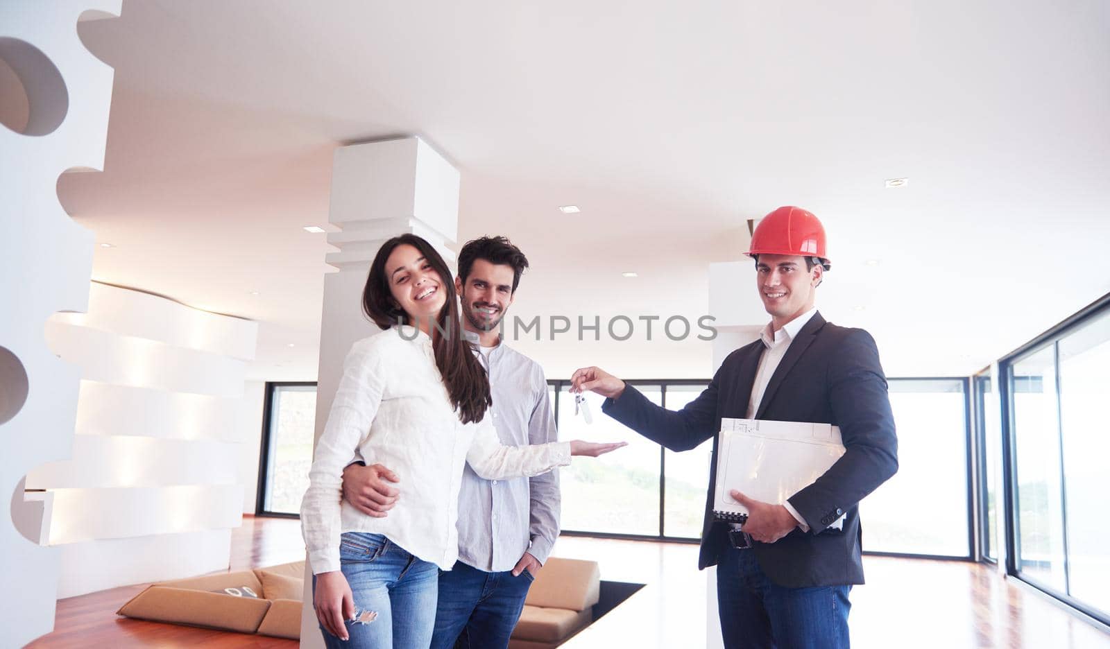 happy young family,  couple buying new home with real estate agent, people group interior