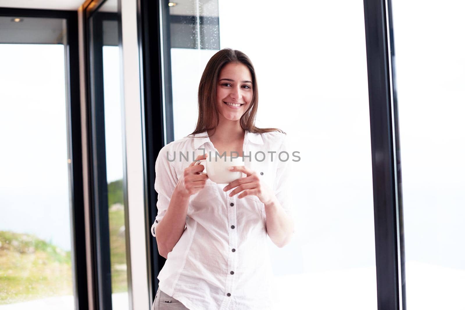 beautiful young woman drink first morning coffee by dotshock