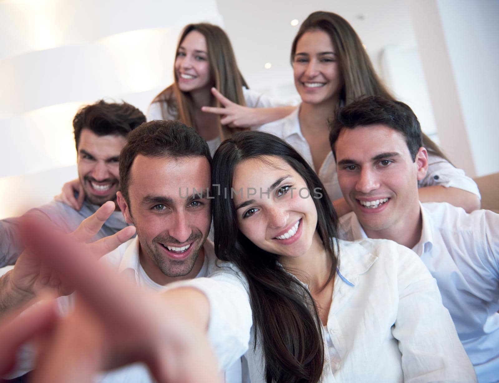 group of friends taking selfie by dotshock