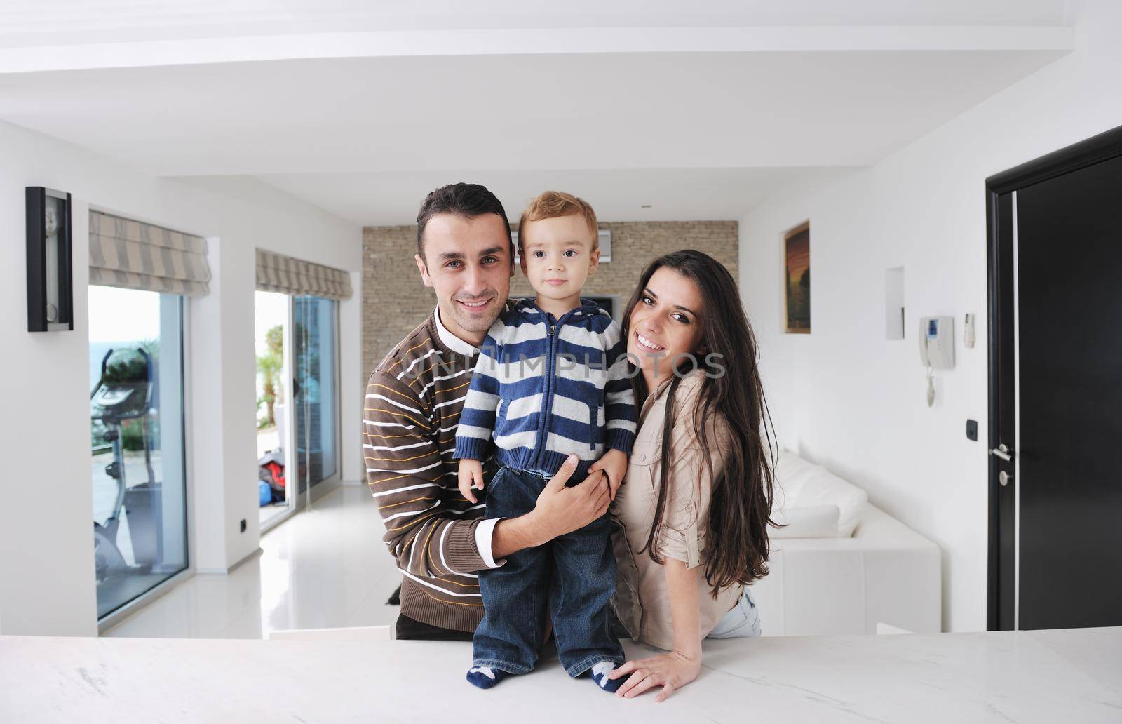 happy young family have fun and relaxing at new home with bright furniture