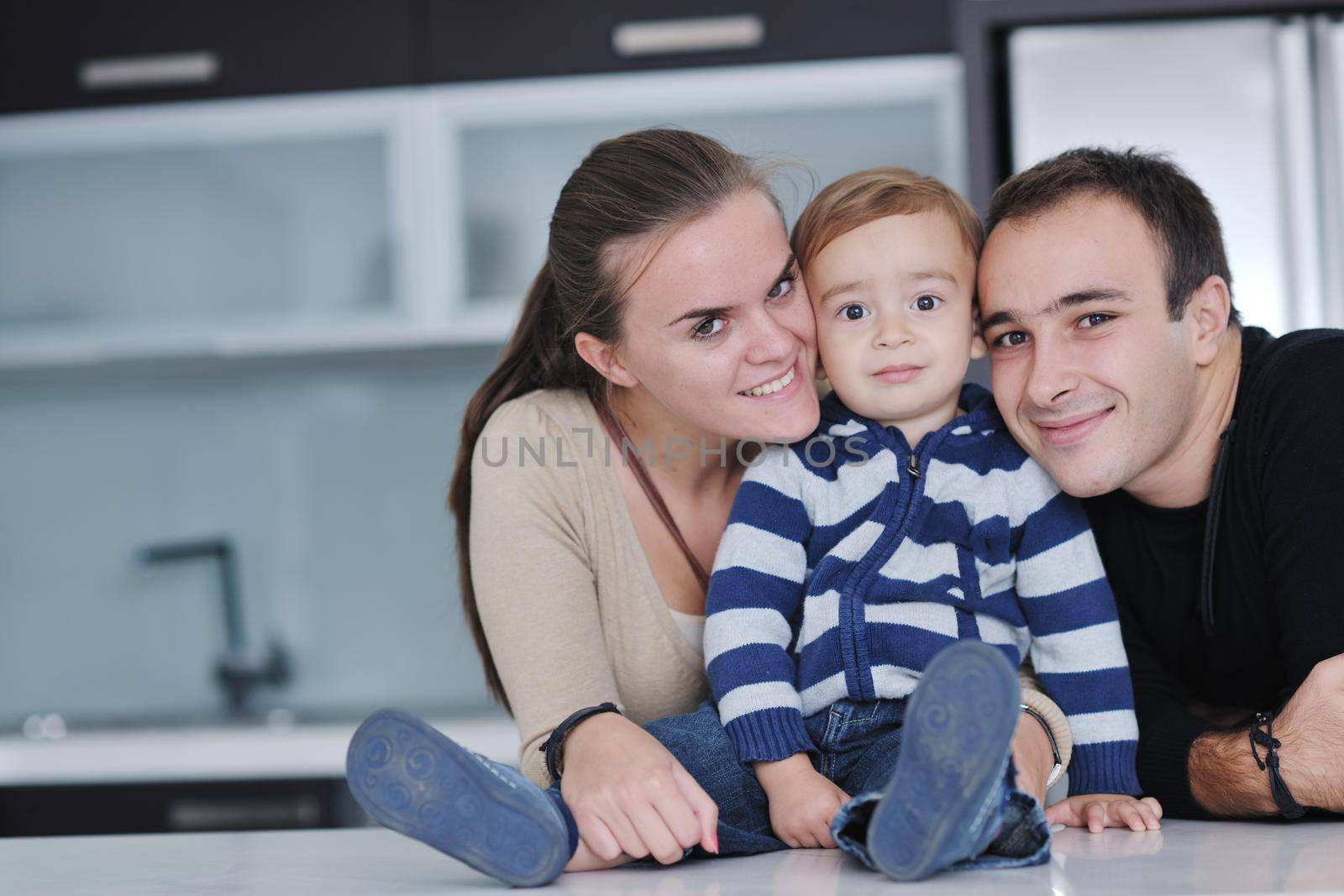 happy young family have fun and relaxing at new home with bright furniture