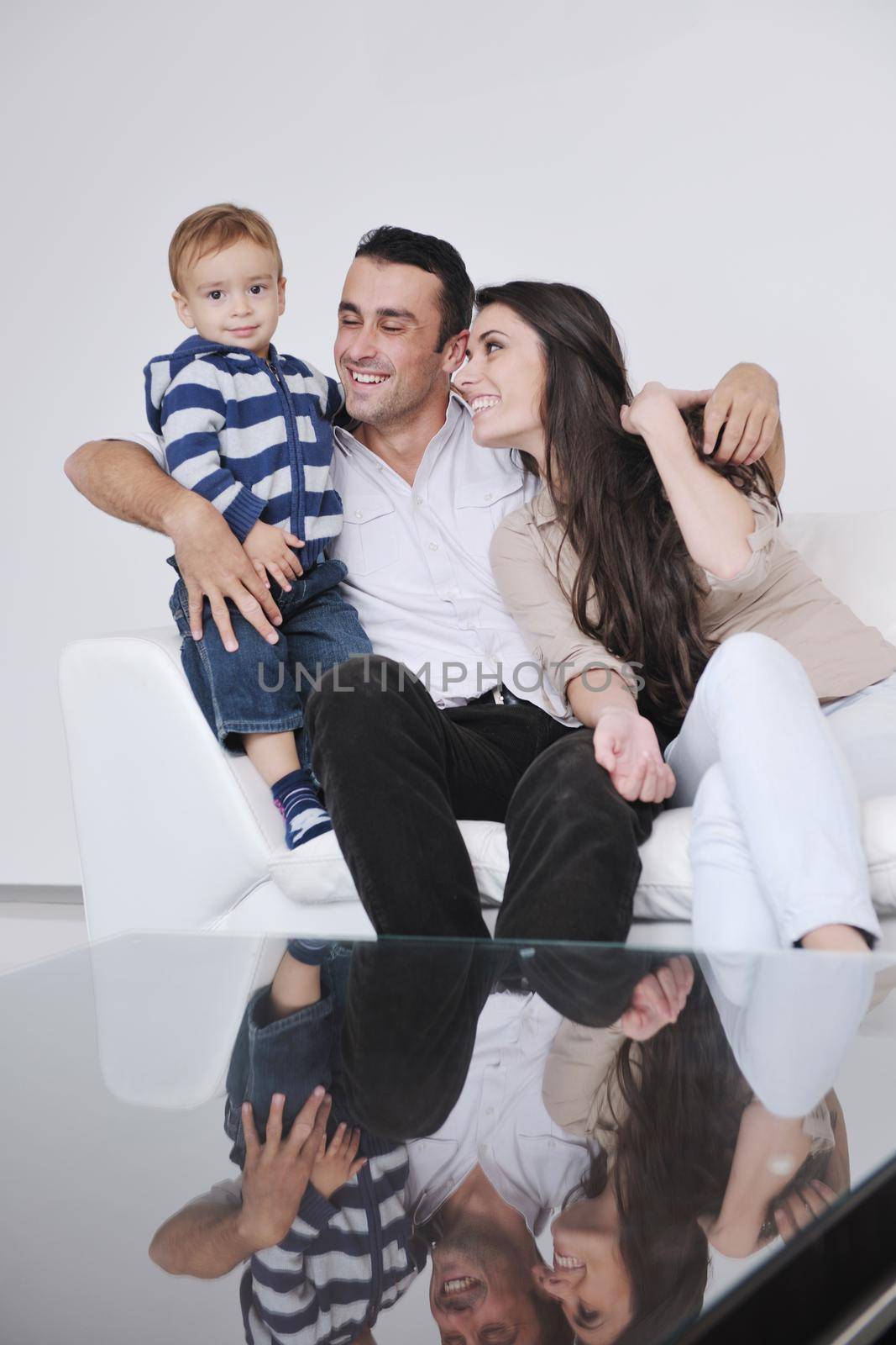 happy young family have fun and relaxing at new home with bright furniture