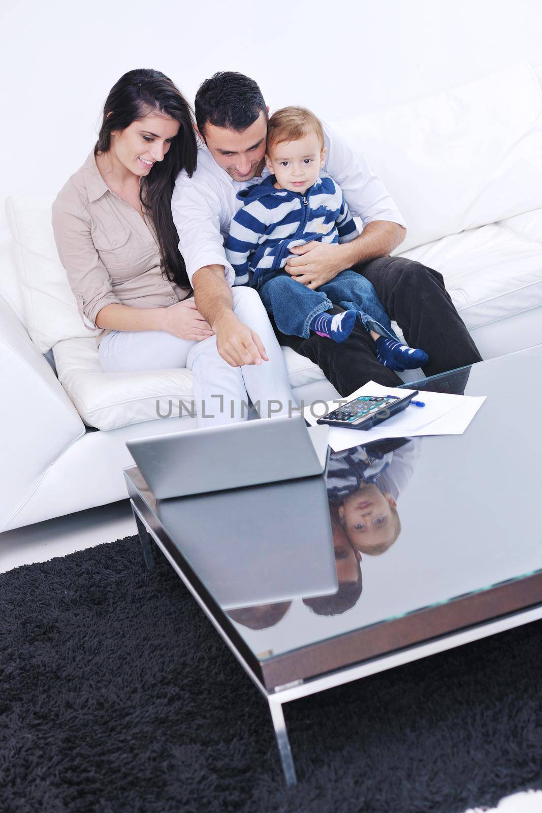 happy young family have fun and relaxing at new home with bright furniture