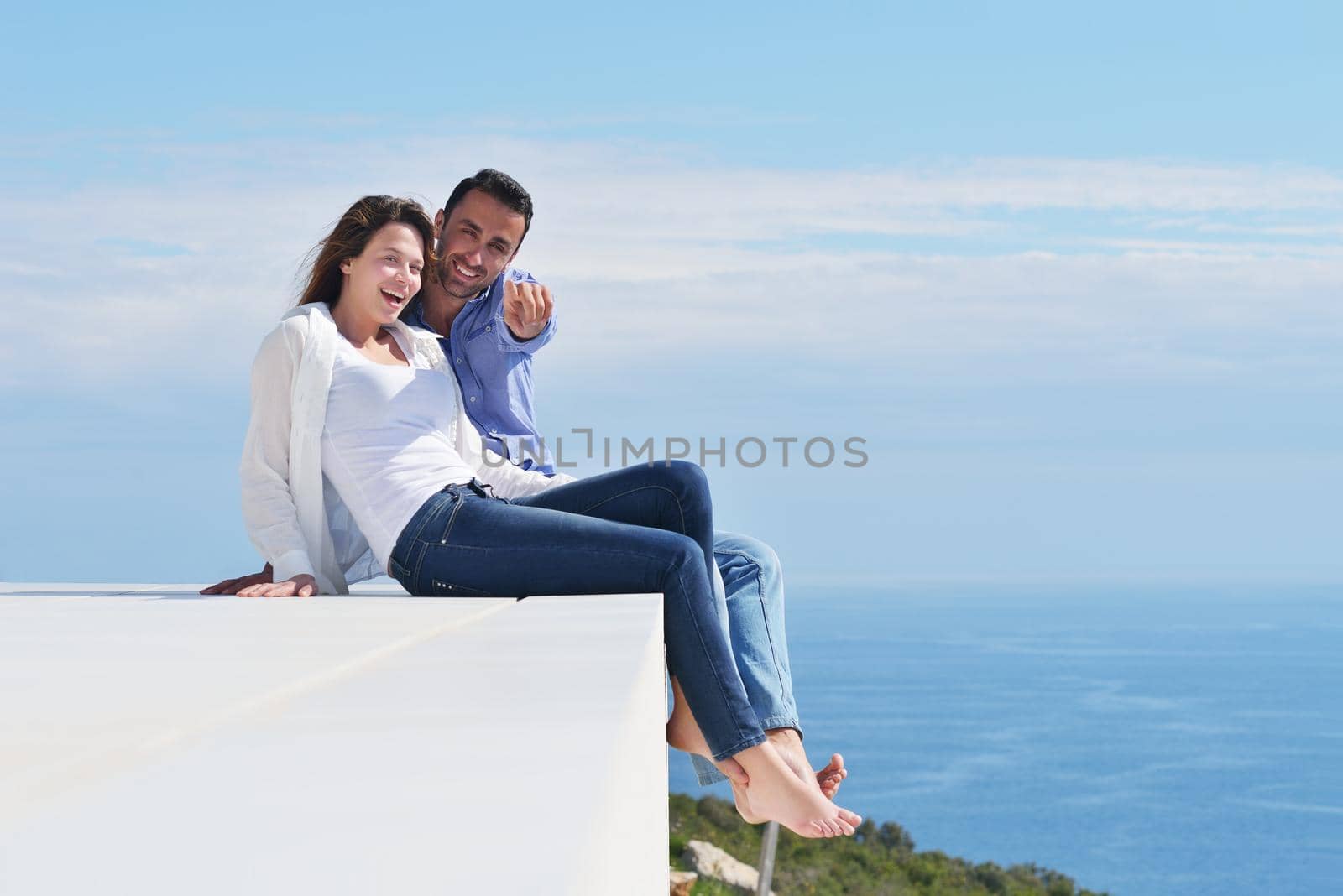 happy young romantic couple have fun relax smile at modern home indoor and outdoor