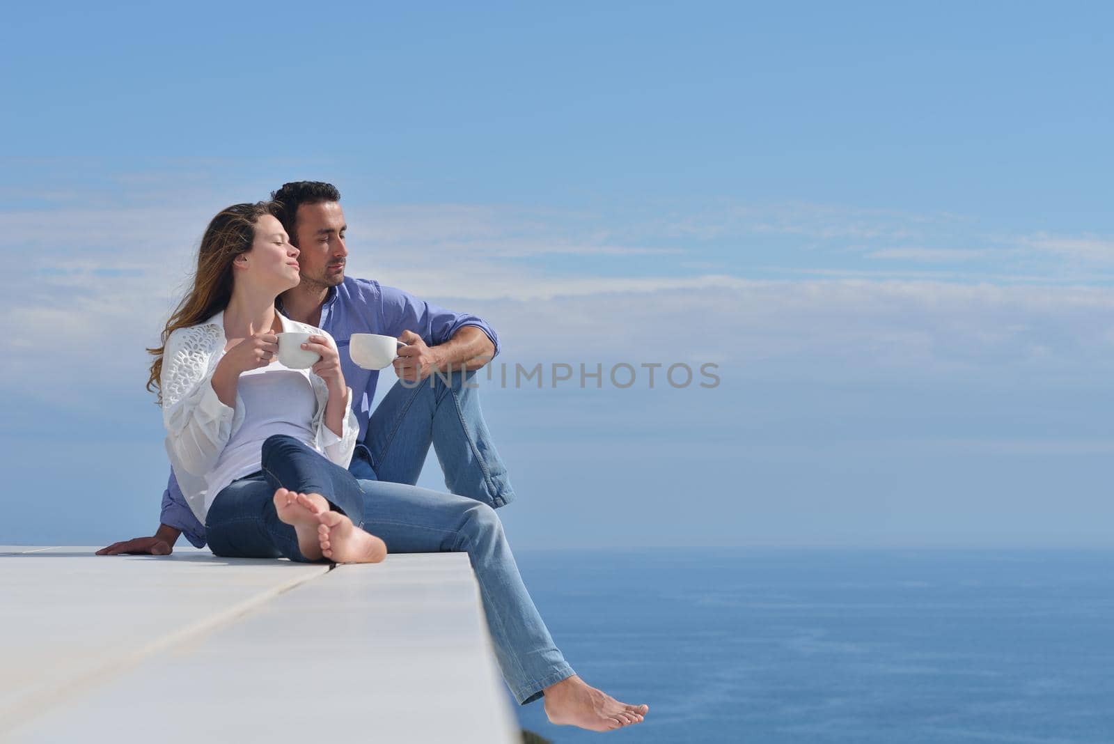 happy young romantic couple have fun relax by dotshock