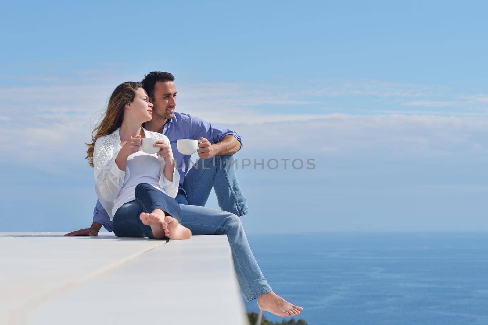 happy young romantic couple have fun relax smile at modern home indoor and outdoor