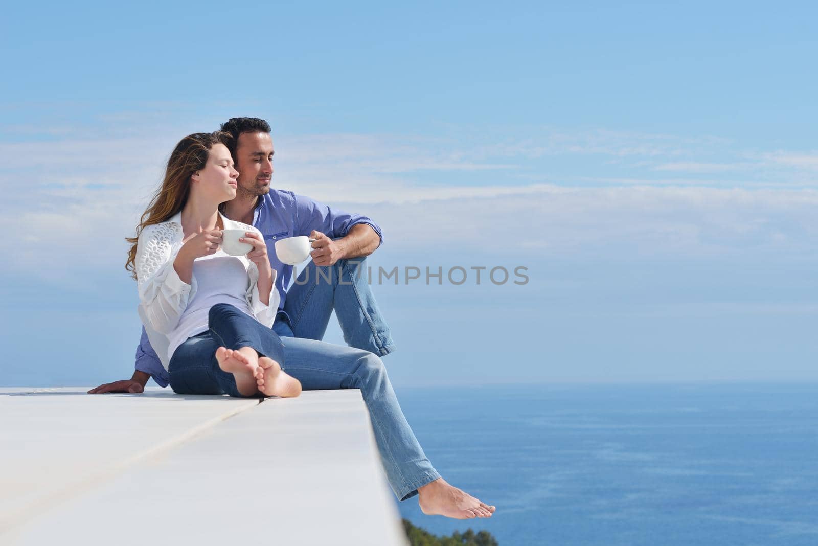 happy young romantic couple have fun relax by dotshock