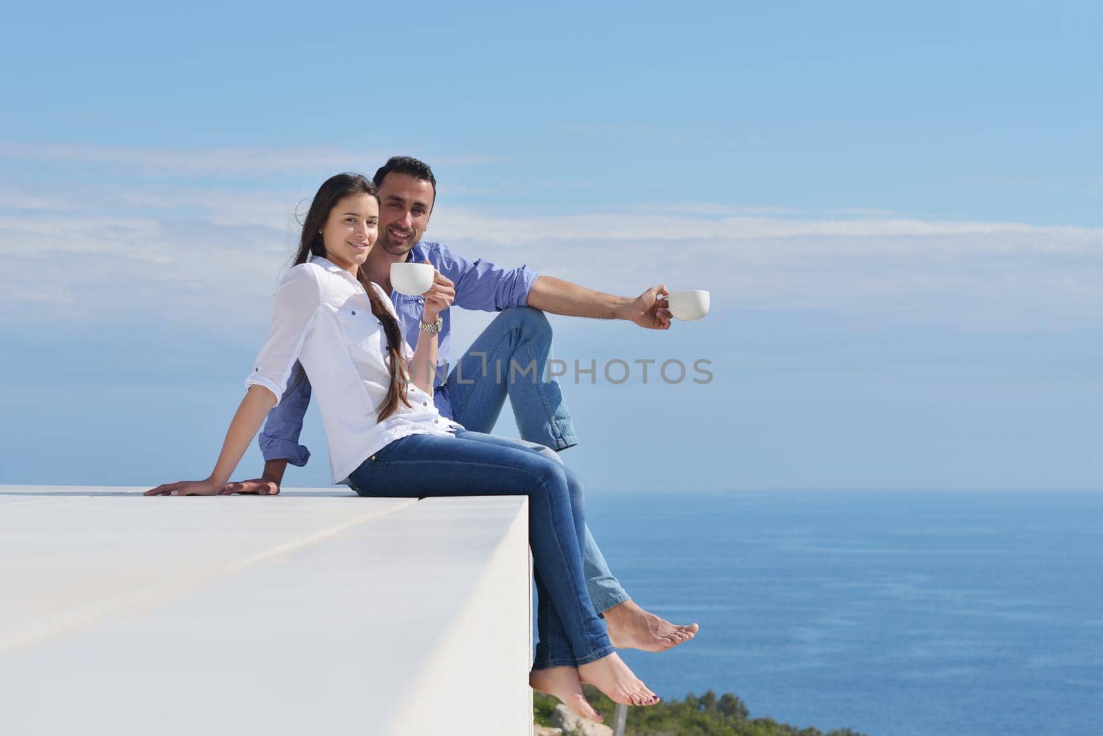 happy young romantic couple have fun relax smile at modern home indoor and outdoor