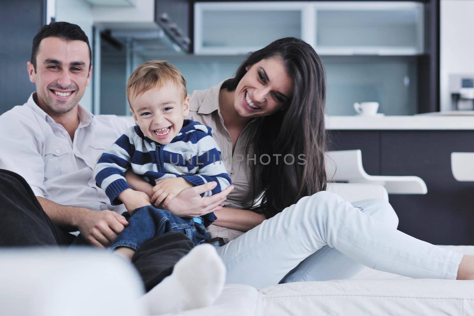 happy young family have fun  at home by dotshock