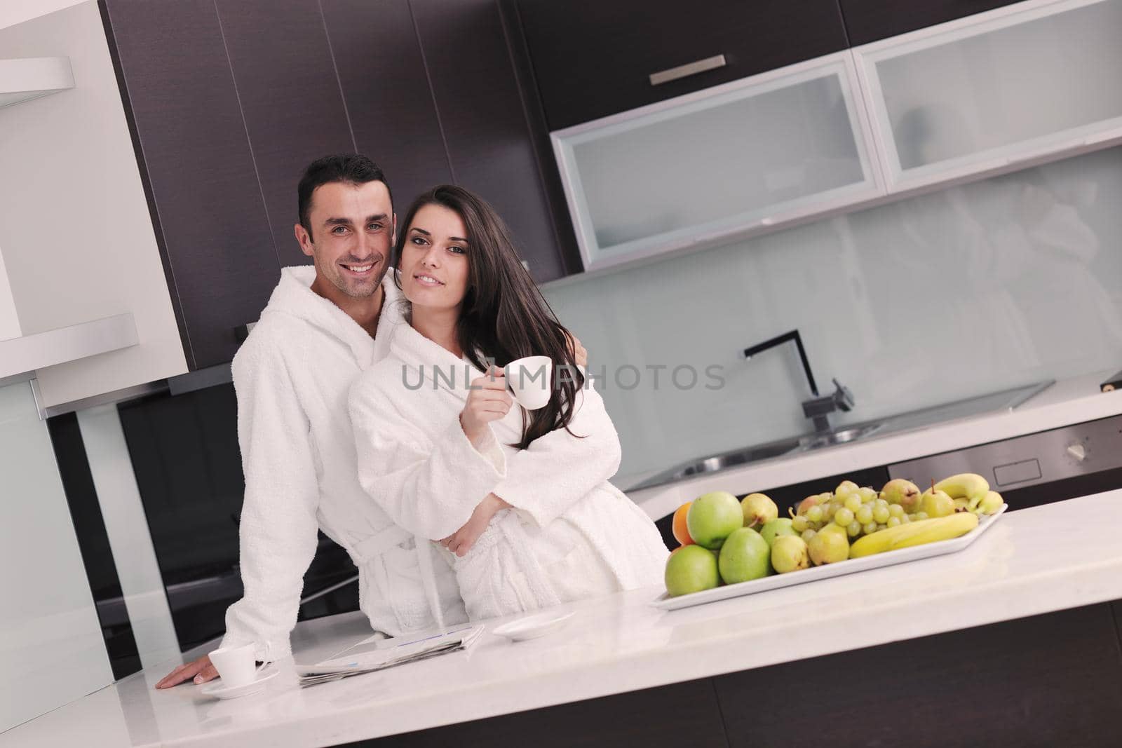 young couple have fun in modern kitchen by dotshock