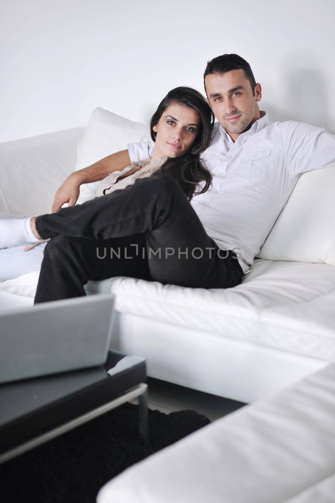 happy young couple relax at modern home living room indoor