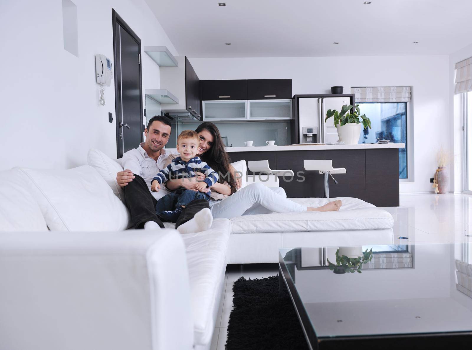 happy young family have fun and relaxing at new home with bright furniture