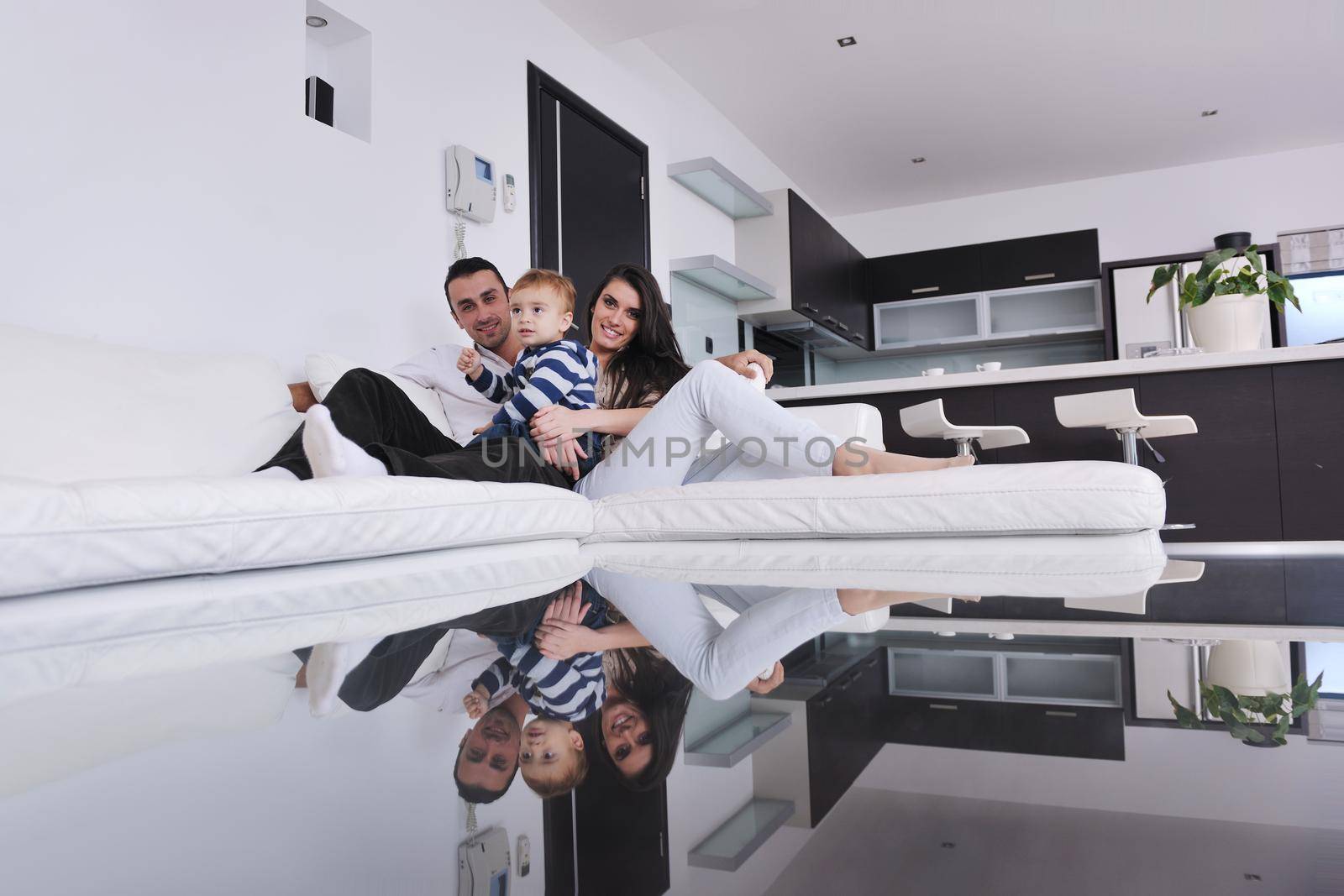 happy young family have fun and relaxing at new home with bright furniture