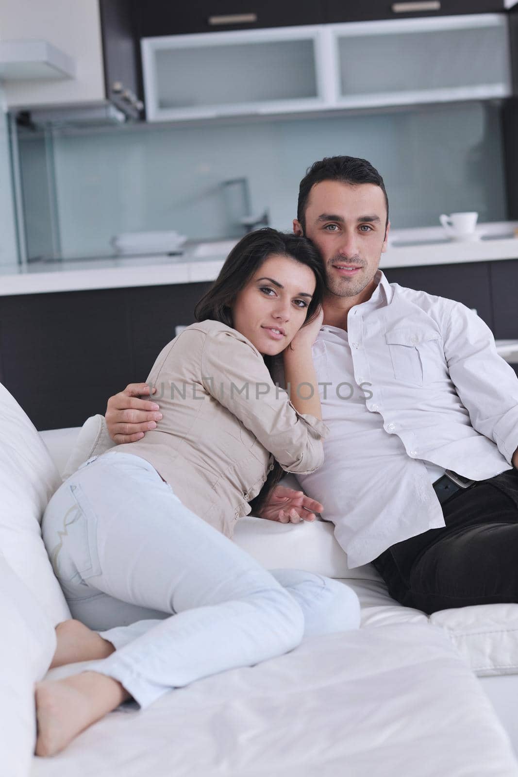 happy young couple relax at modern home living room indoor