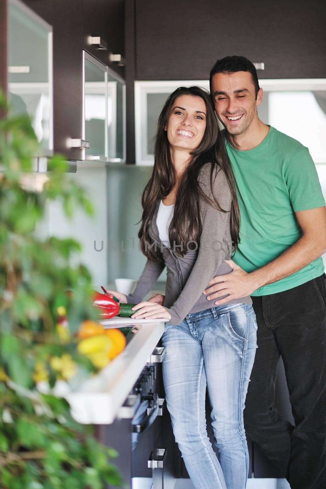 young couple have fun in modern kitchen by dotshock