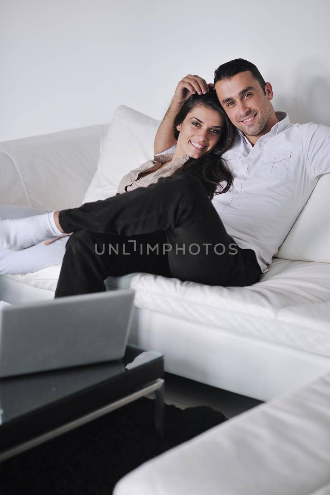 happy young couple relax at modern home living room indoor