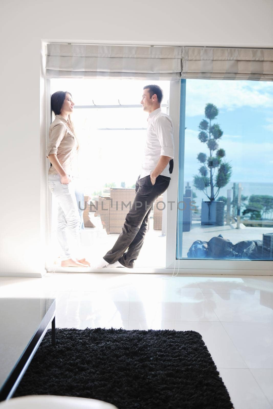 happy young couple relax at modern home living room indoor