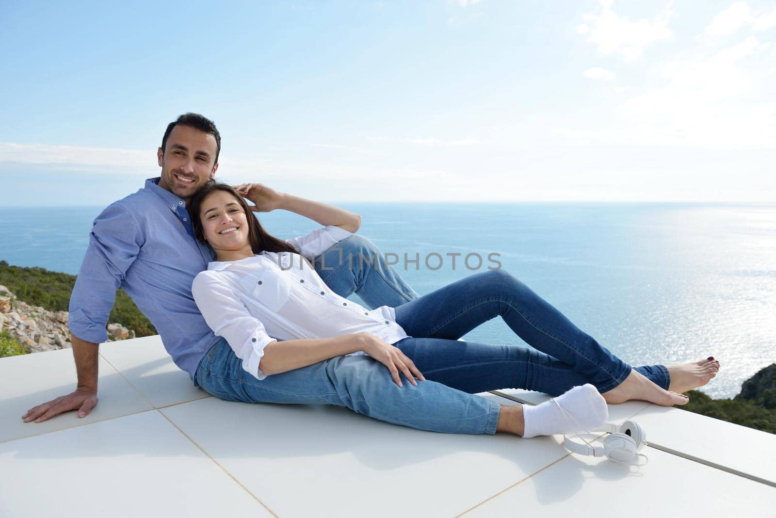 relaxed young couple at home by dotshock