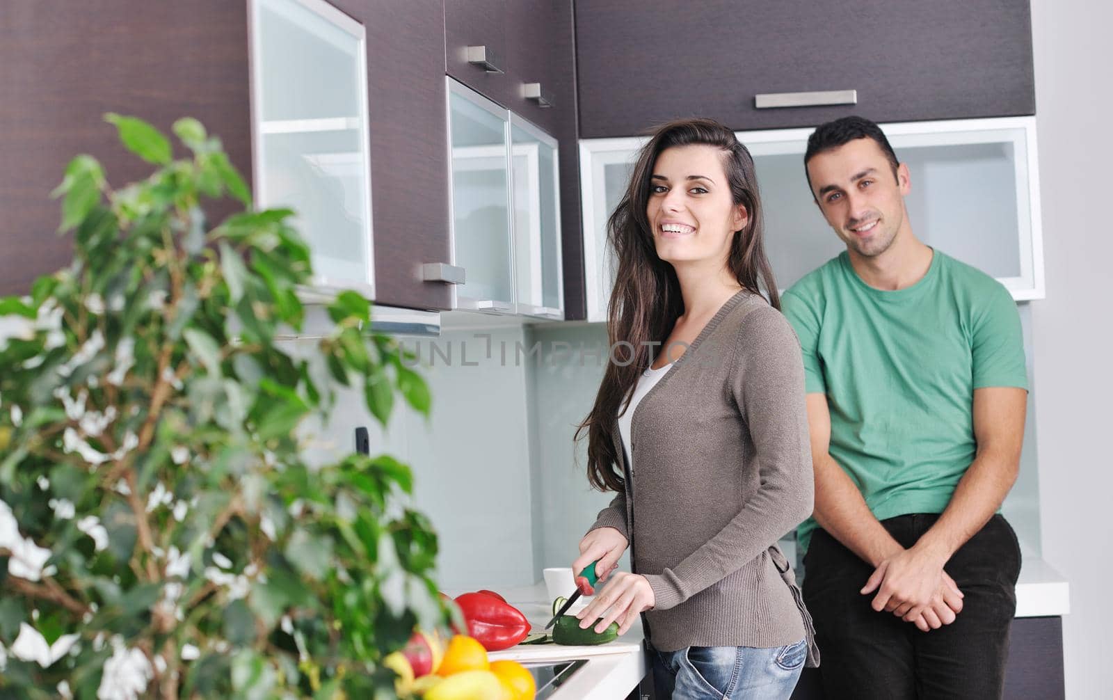 young couple have fun in modern kitchen by dotshock