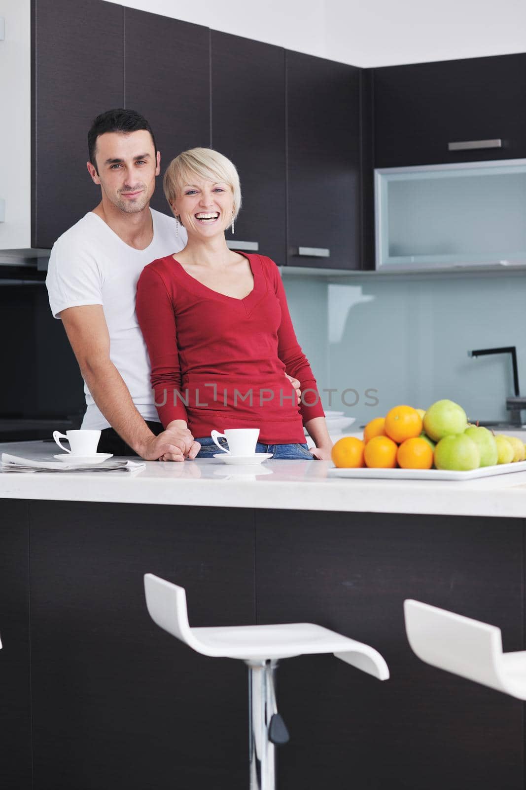 young couple have fun in modern kitchen by dotshock