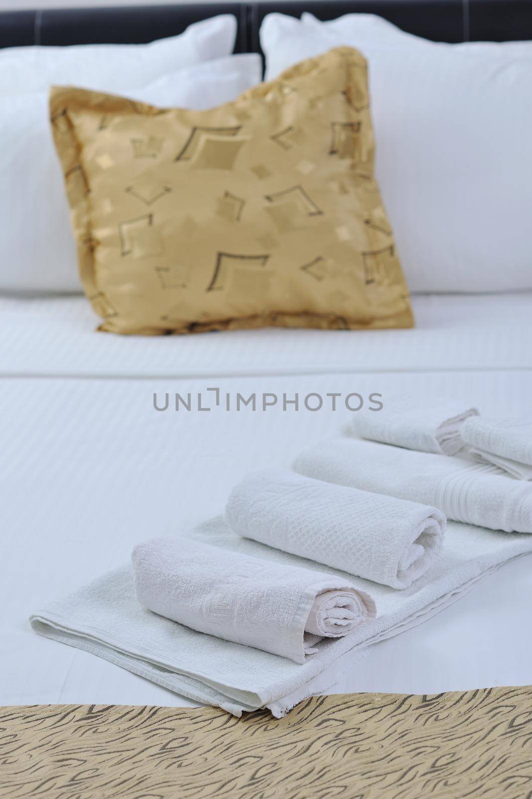towels in hotel room by dotshock