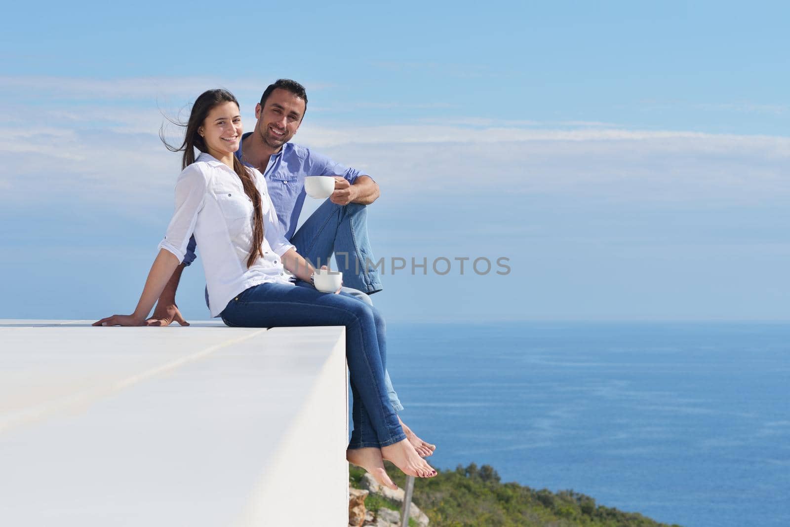 happy young romantic couple have fun relax smile at modern home indoor and outdoor