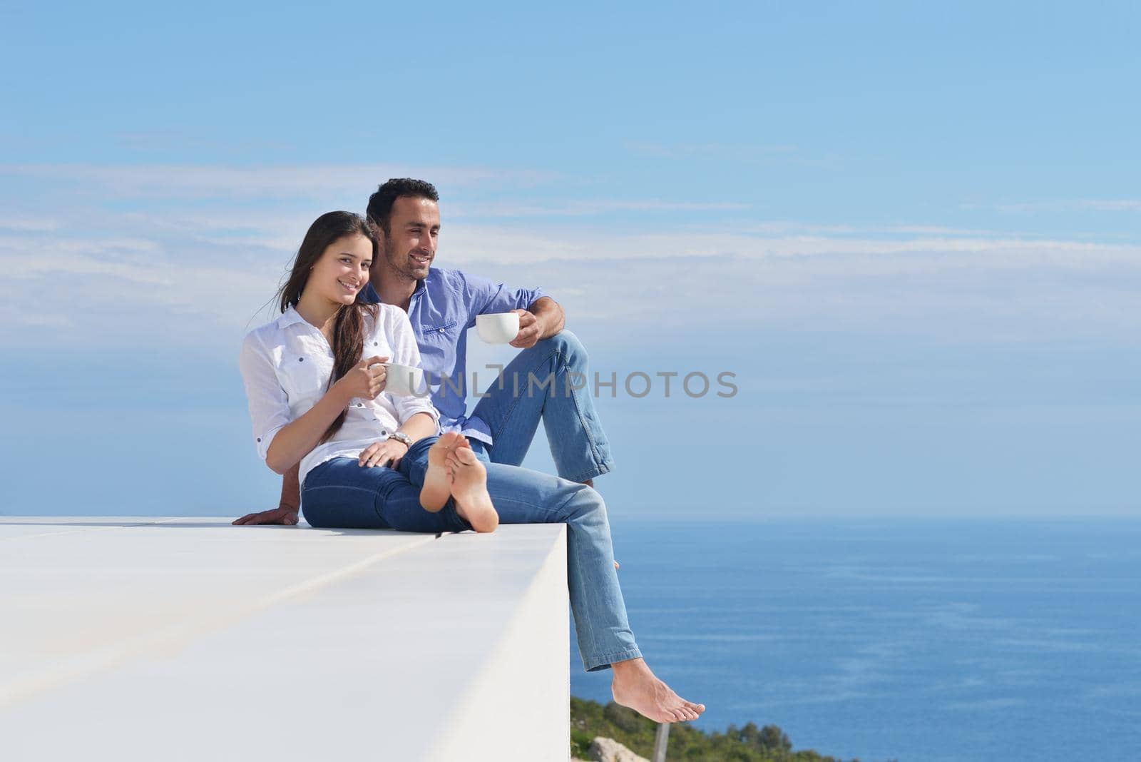 happy young romantic couple have fun relax smile at modern home indoor and outdoor