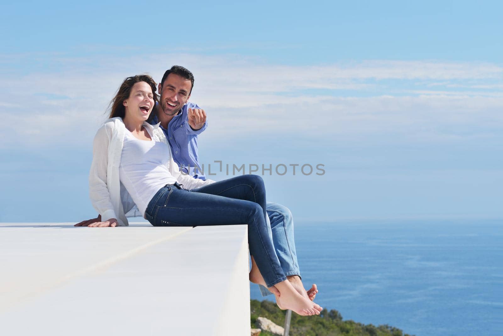 happy young romantic couple have fun relax smile at modern home indoor and outdoor