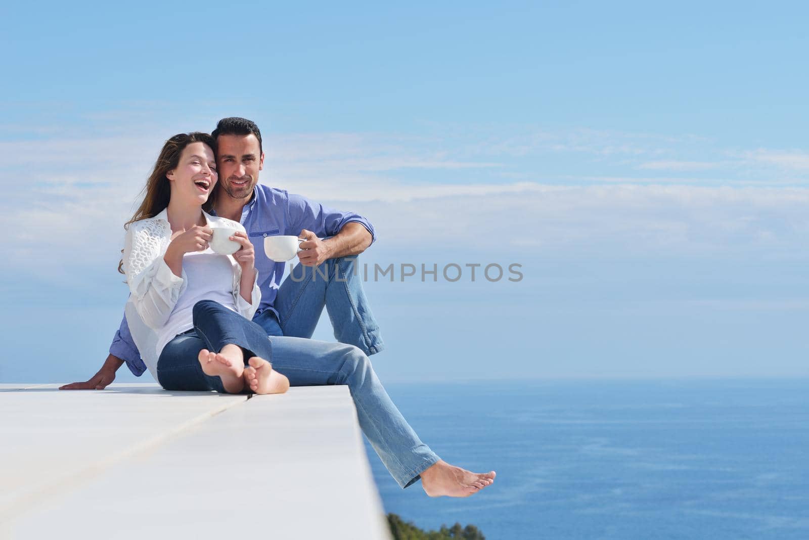 happy young romantic couple have fun relax smile at modern home indoor and outdoor