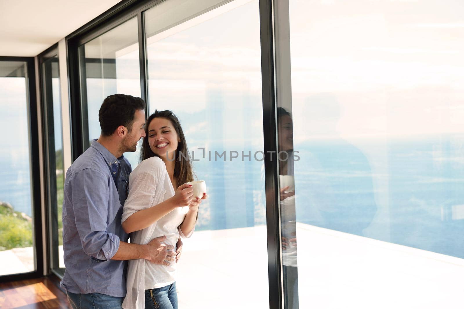 romantic happy young couple relax at modern home indoors