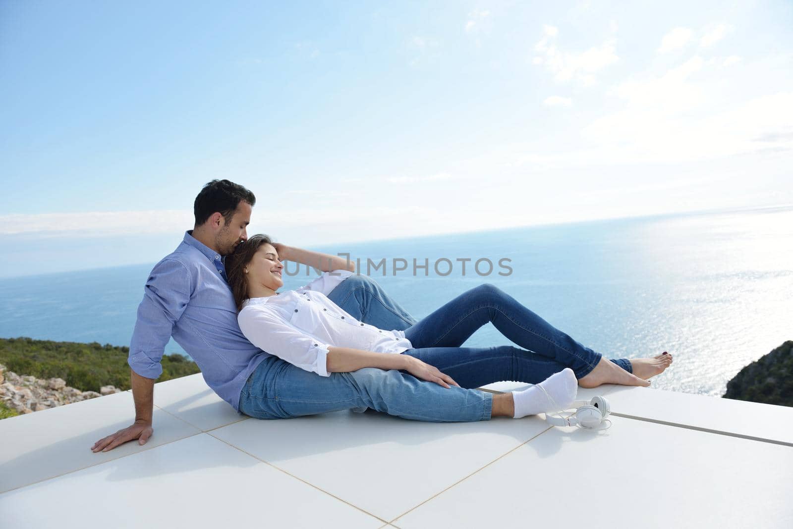 relaxed young couple at home by dotshock